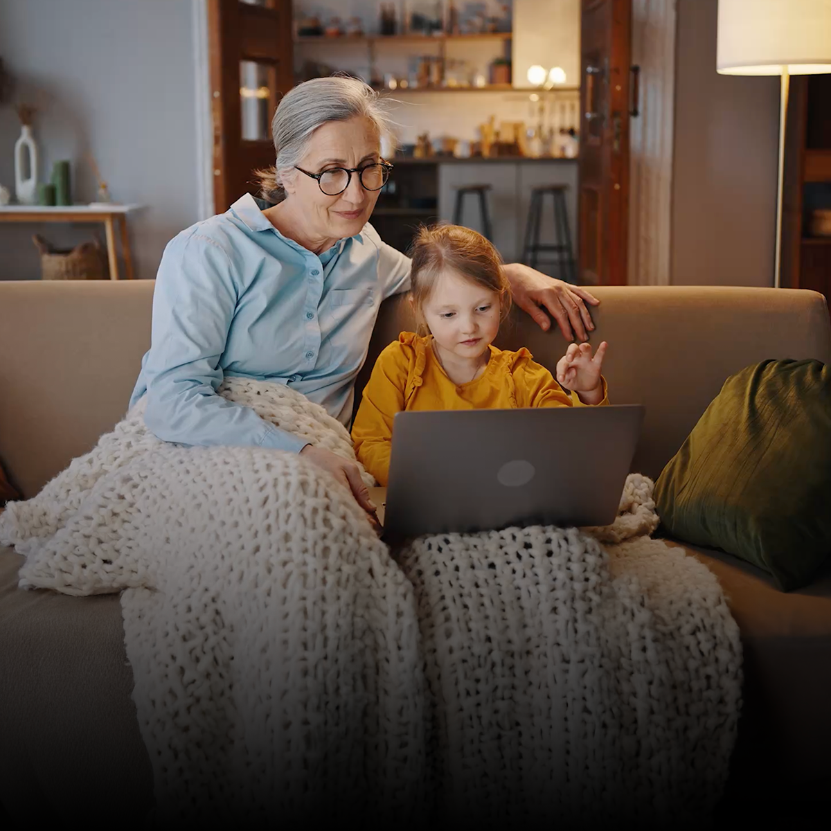 grandmother and child reading together